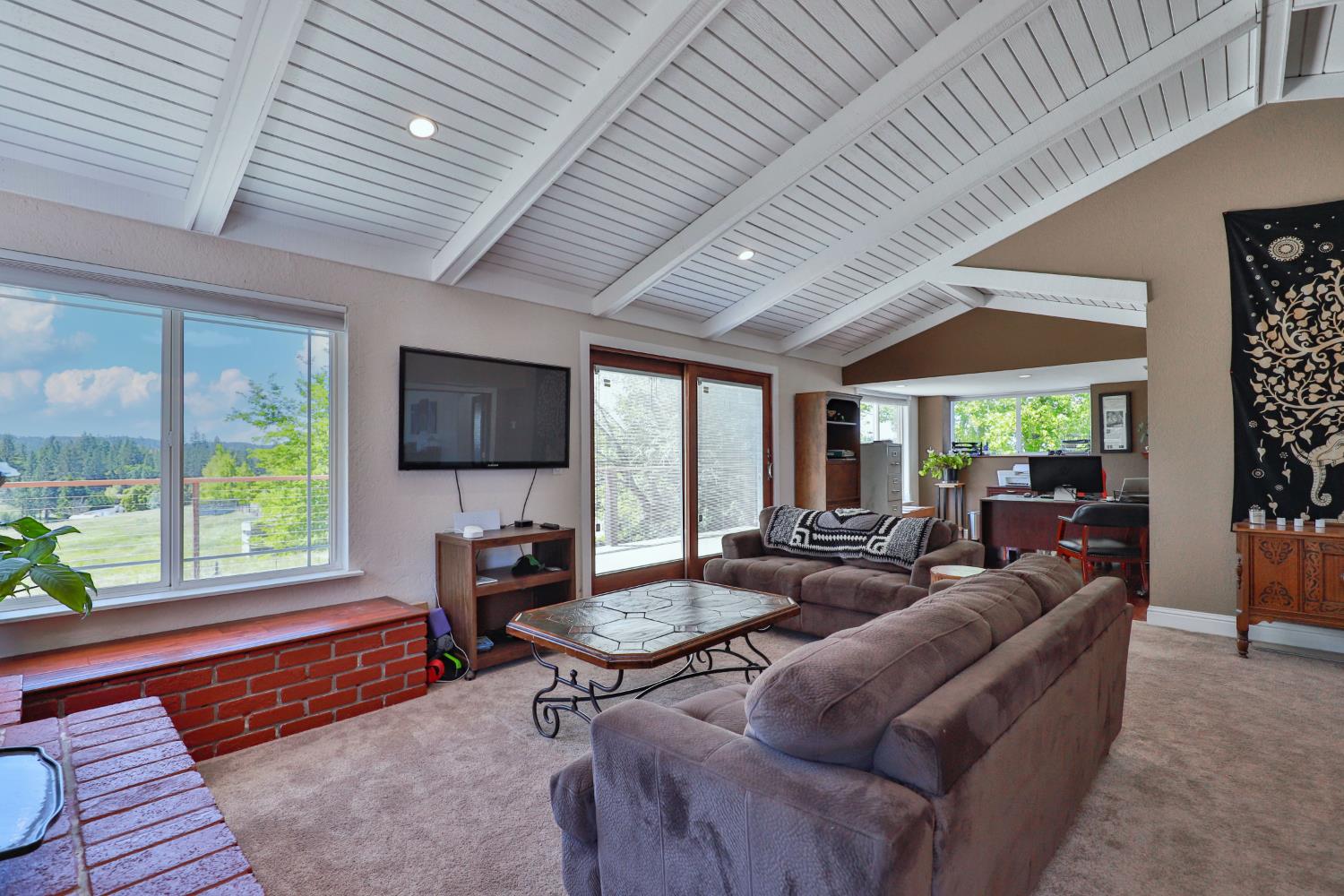 3081 Little Spur Road Somerset, CA 95684 - Photo 23 of 83 Master suite living room featuring vaulted ceiling , out door access to large deck for viewing surrounding vineyards and mountain sides. Also nice office area.