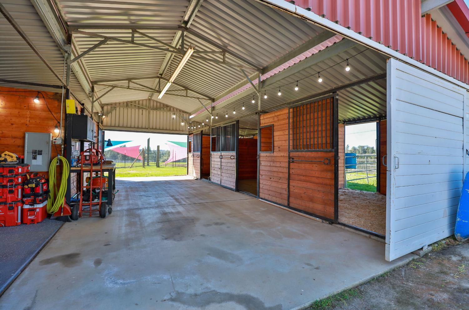 3081 Little Spur Road Somerset, CA 95684 - Photo 72 of 83 Four stall barn has separate hay storage area and wash rack. Out doors lead to paddocks. Many uses!!!!