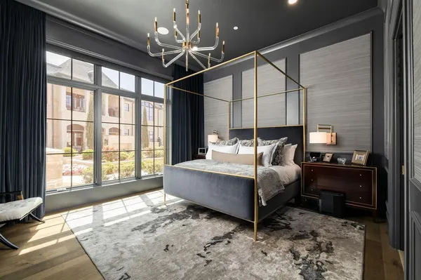 a bed room with furniture and a chandelier