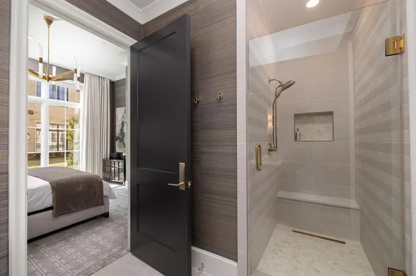 a bathroom with a bathtub and a shower