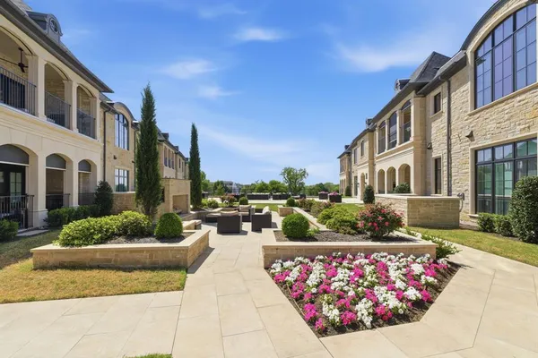 a view of a patio with couches and potted plants