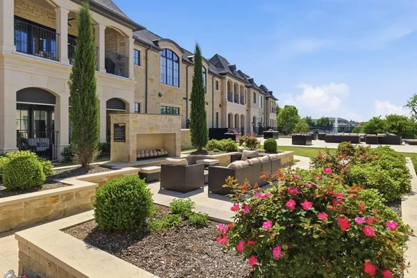 a view of swimming pool with outdoor seating and plants