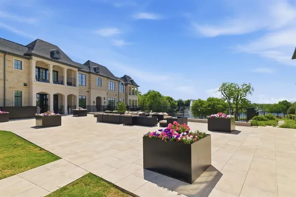 a view of a patio with couches and potted plants