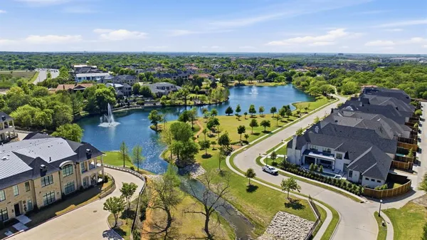 a view of a lake with couches and city view