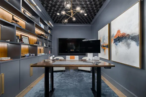 a view of a workspace with furniture