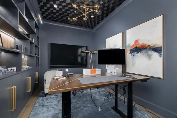 a view of a workspace with furniture