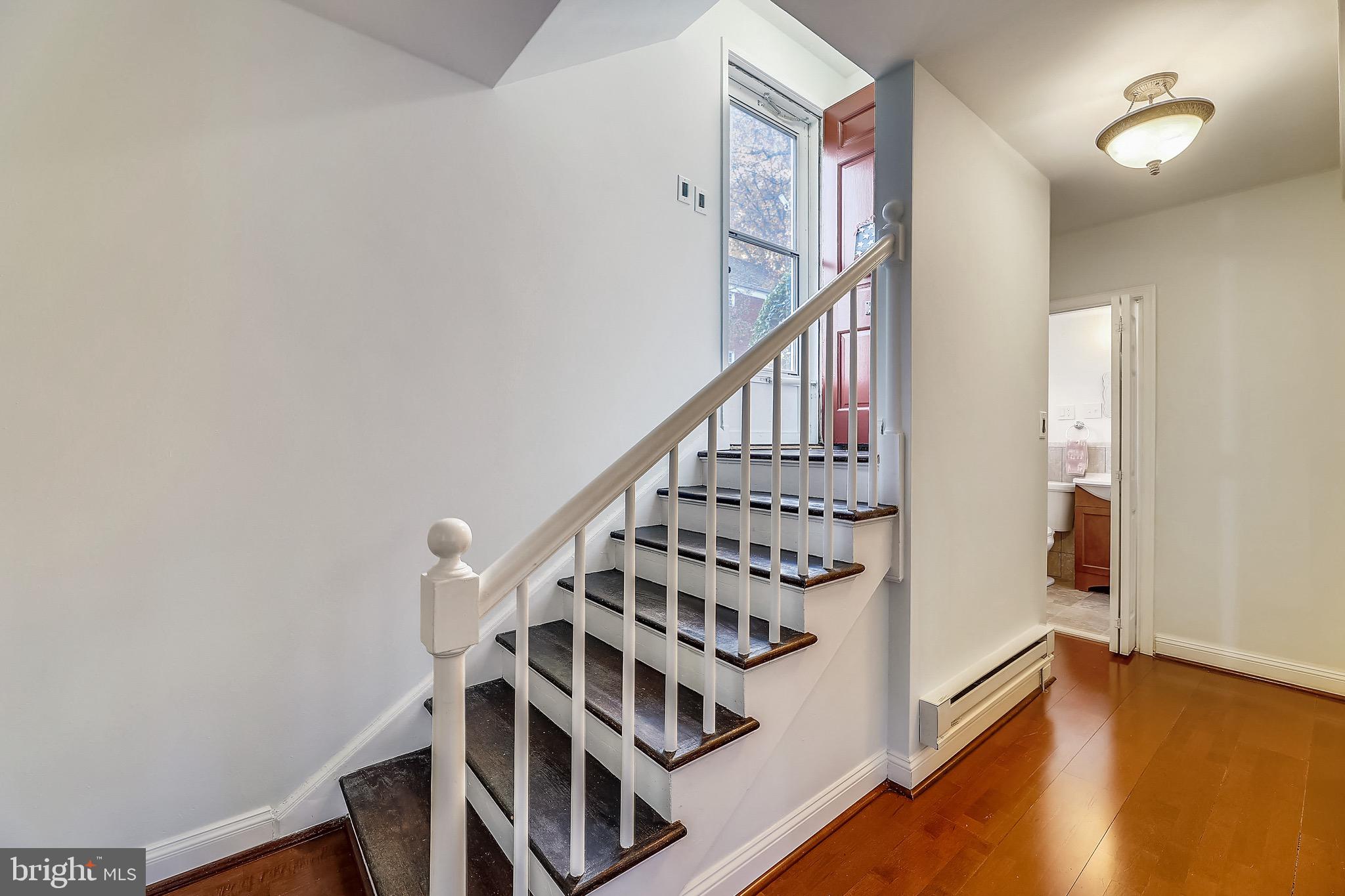 3710 Gunston Road, Unit 920 Alexandria, VA 22302 - Photo 2 of 15 Stairs down from front door into entry hallway