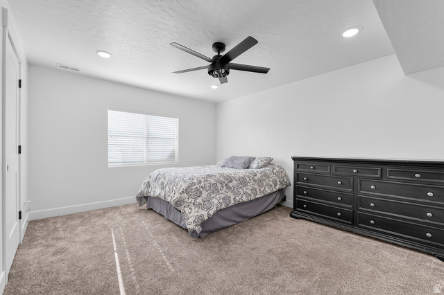 1426 South 1450th Street West Mapleton, UT 84664 - Photo 18 of 50 Carpeted room featuring a ceiling fan, recessed lighting, and a window with blinds