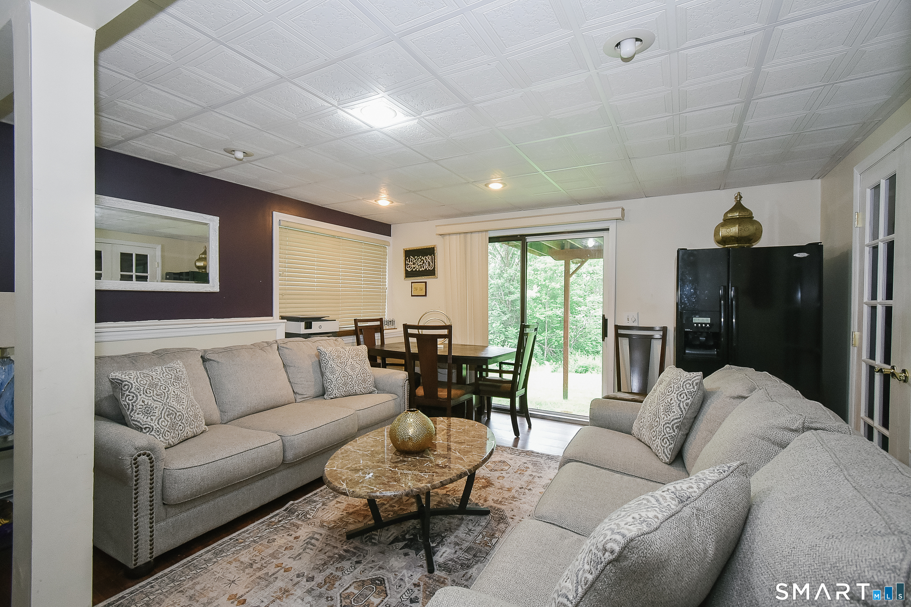 148 Peck Road Torrington, CT 06790 - Photo 21 of 23 GREAT ROOM WITH A SLIDING DOOR TO THE BACKYARD