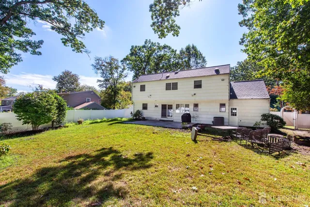a view of a house with sitting area and garden