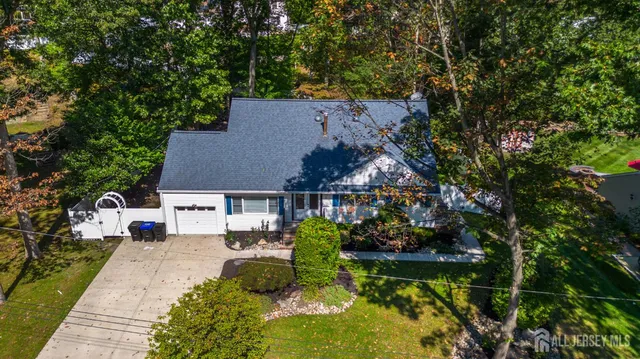 an aerial view of a house with a garden