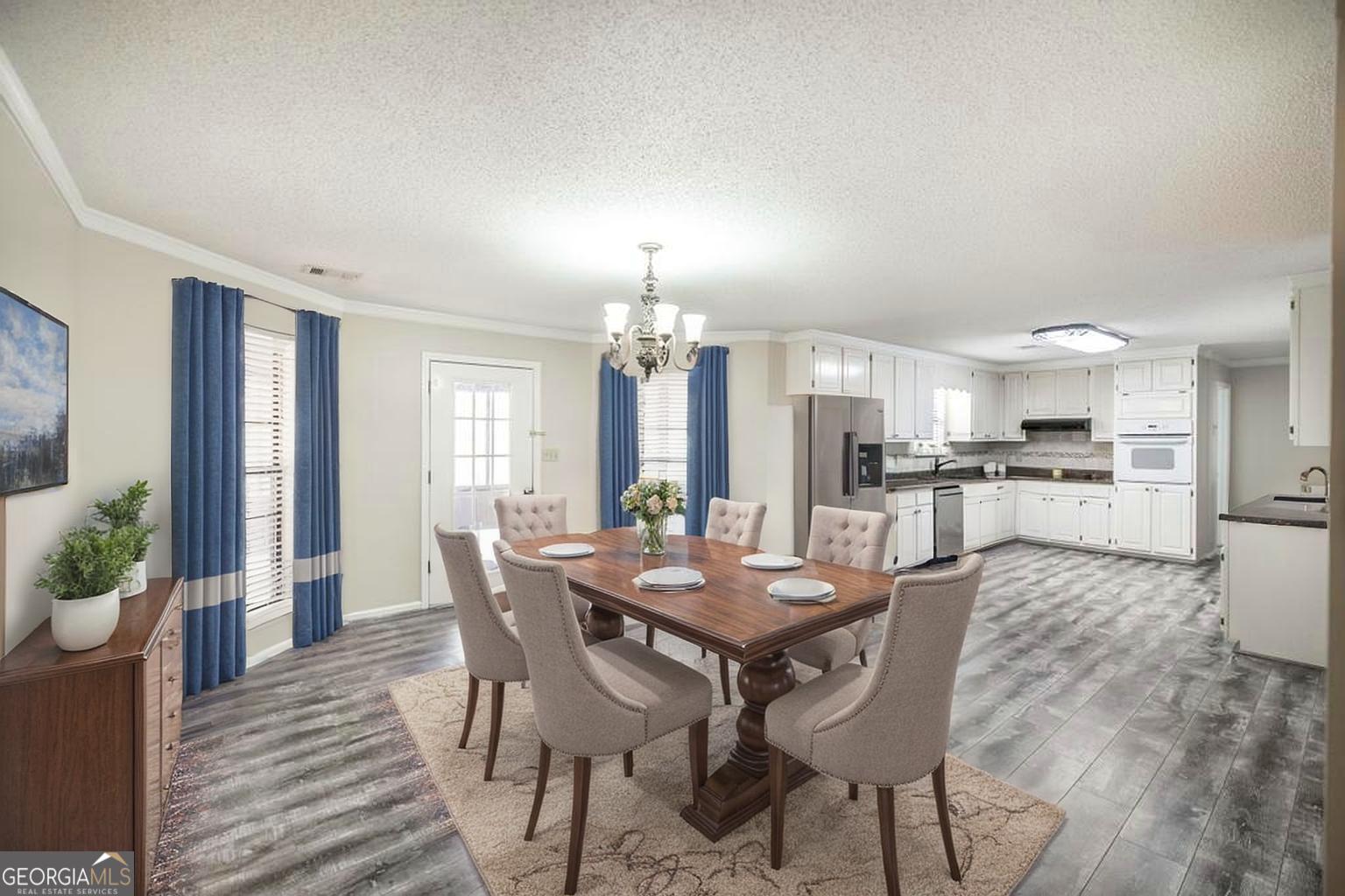 925 West Tanglewood Drive Dublin, GA 31021 - Photo 14 of 43 a view of a dining room with furniture and wooden floor