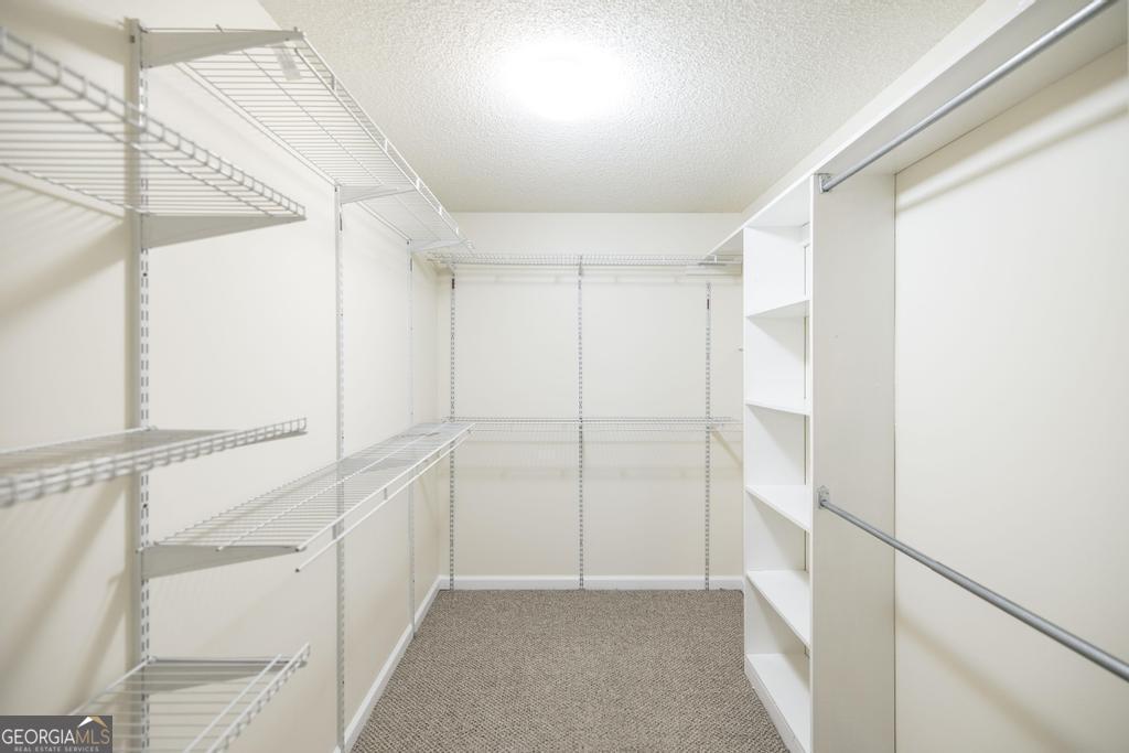 925 West Tanglewood Drive Dublin, GA 31021 - Photo 26 of 43 a view of walk in closet with empty racks