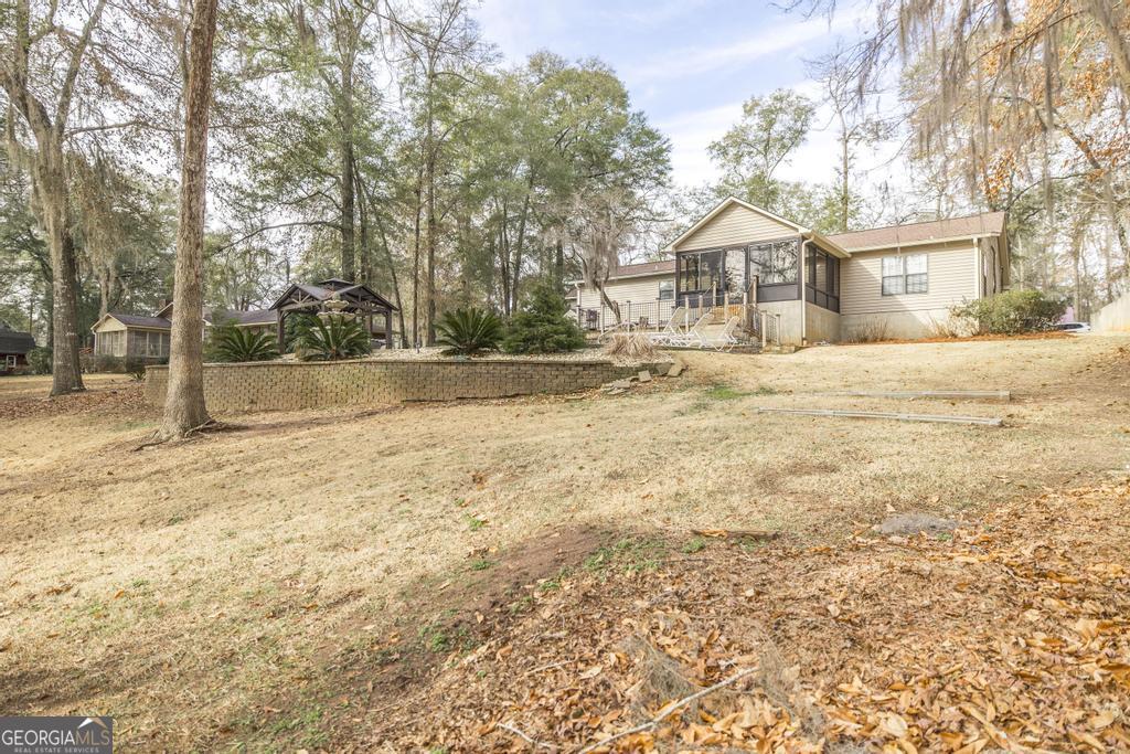 925 West Tanglewood Drive Dublin, GA 31021 - Photo 36 of 43 a front view of a house with a yard covered in snow