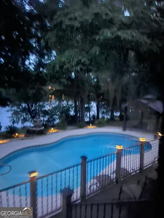 a view of a yard and a house with a backyard