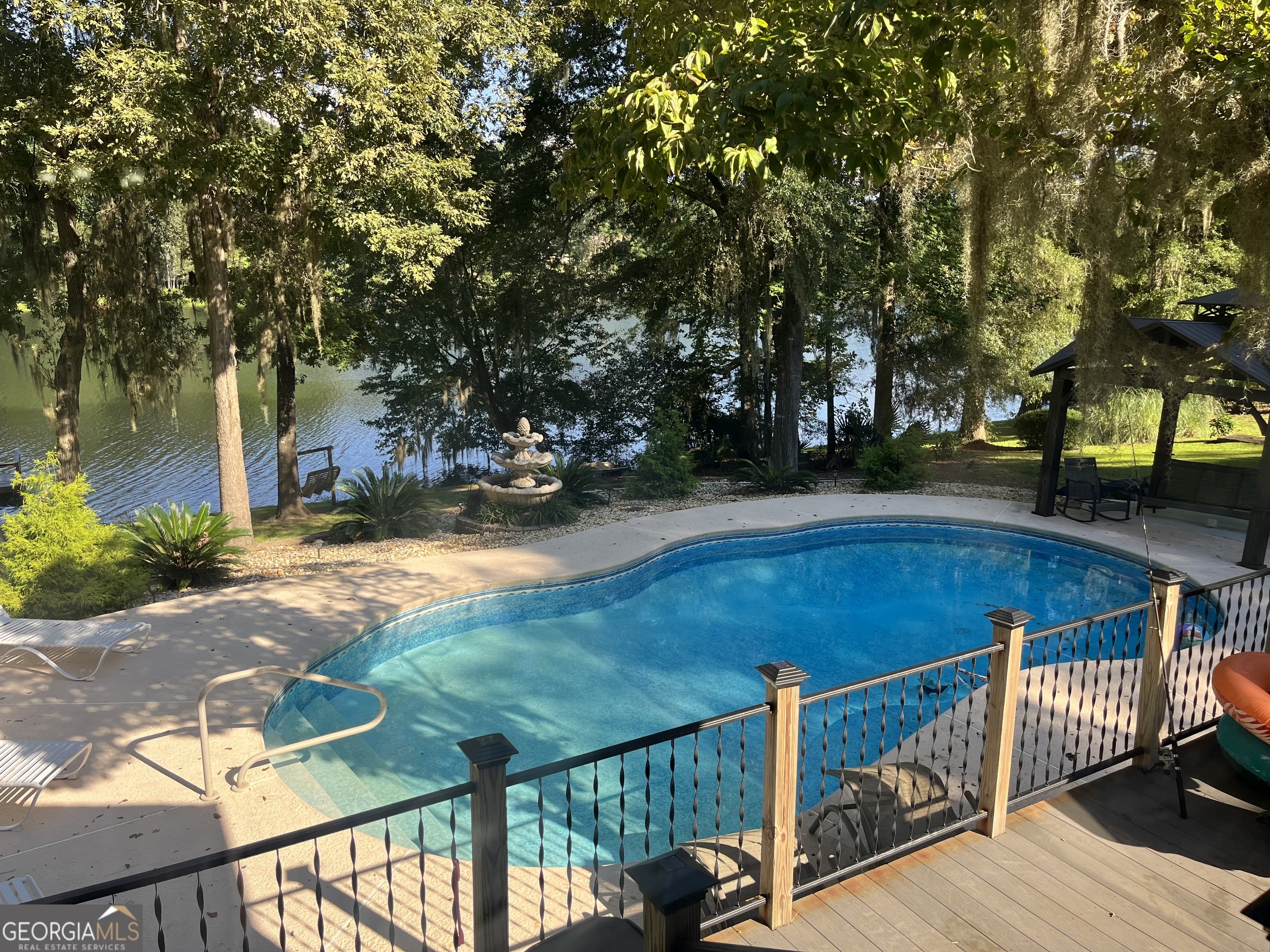 925 West Tanglewood Drive Dublin, GA 31021 - Photo 5 of 43 a view of yard with deck and trees
