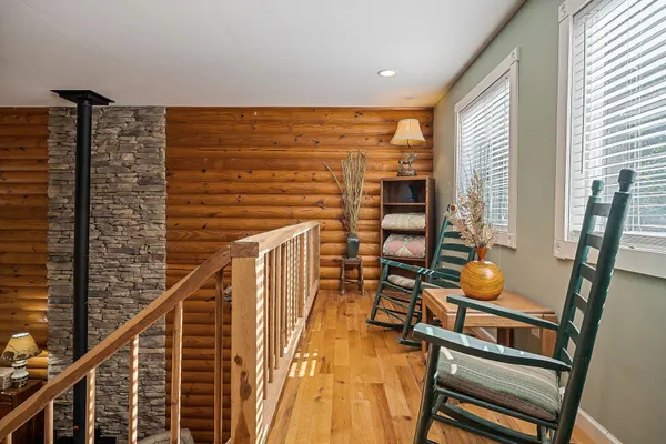 a view of a living room and bedroom with furniture
