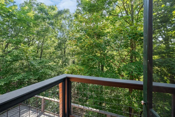 a view of balcony with wooden floor