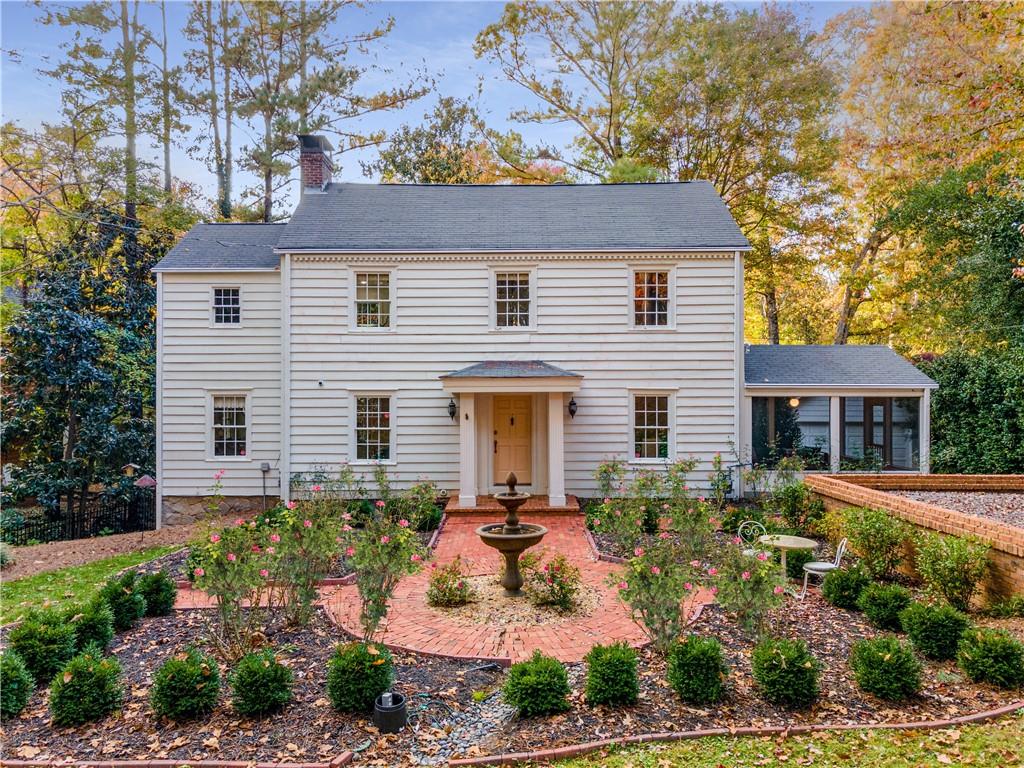 3580 Ivy Road Northeast Atlanta, GA 30342 - Photo 1 of 1 a front view of a house with a yard