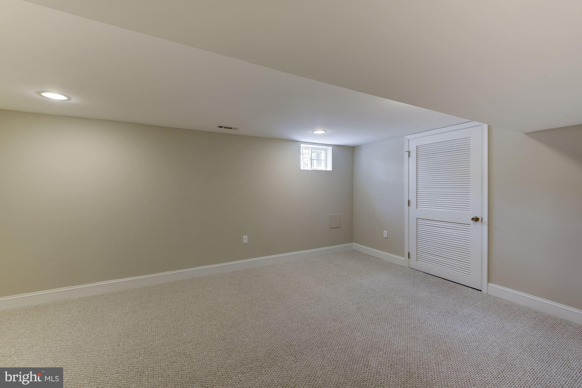 9415 Colesville Road Silver Spring, MD 20901 - Photo 23 of 34 Lower level rec room/game room