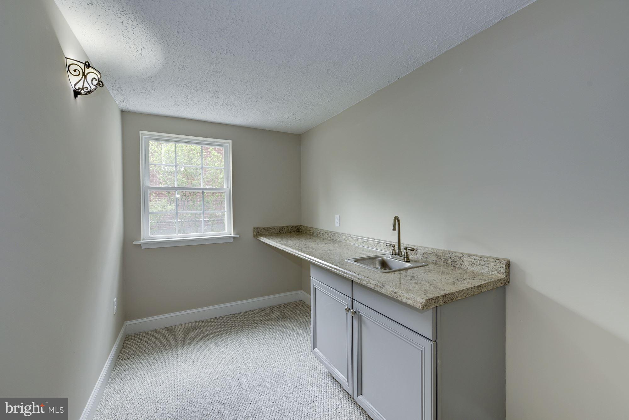9415 Colesville Road Silver Spring, MD 20901 - Photo 27 of 34 Lower level wet bar