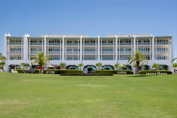 a front view of house with yard and outdoor seating