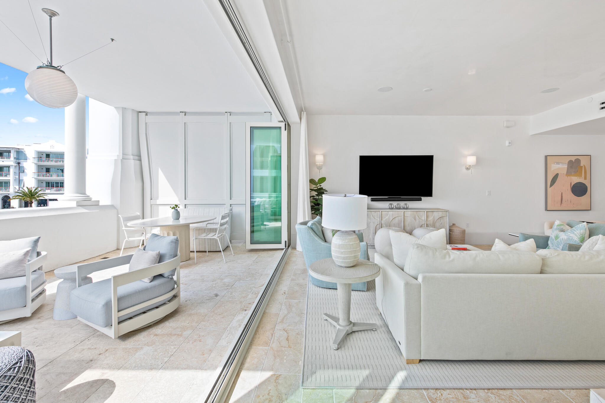 27 Admiralty Row, Unit 207 Inlet Beach, FL 32461 - Photo 3 of 37 a living room with furniture a flat screen tv and a large window