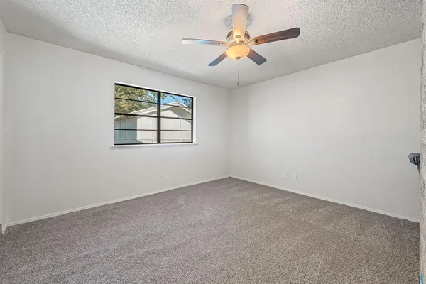 a room with a washing machine and a shower