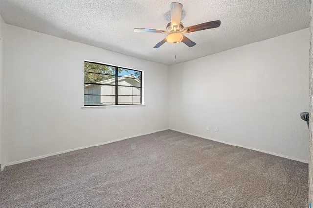 a room with a washing machine and a shower