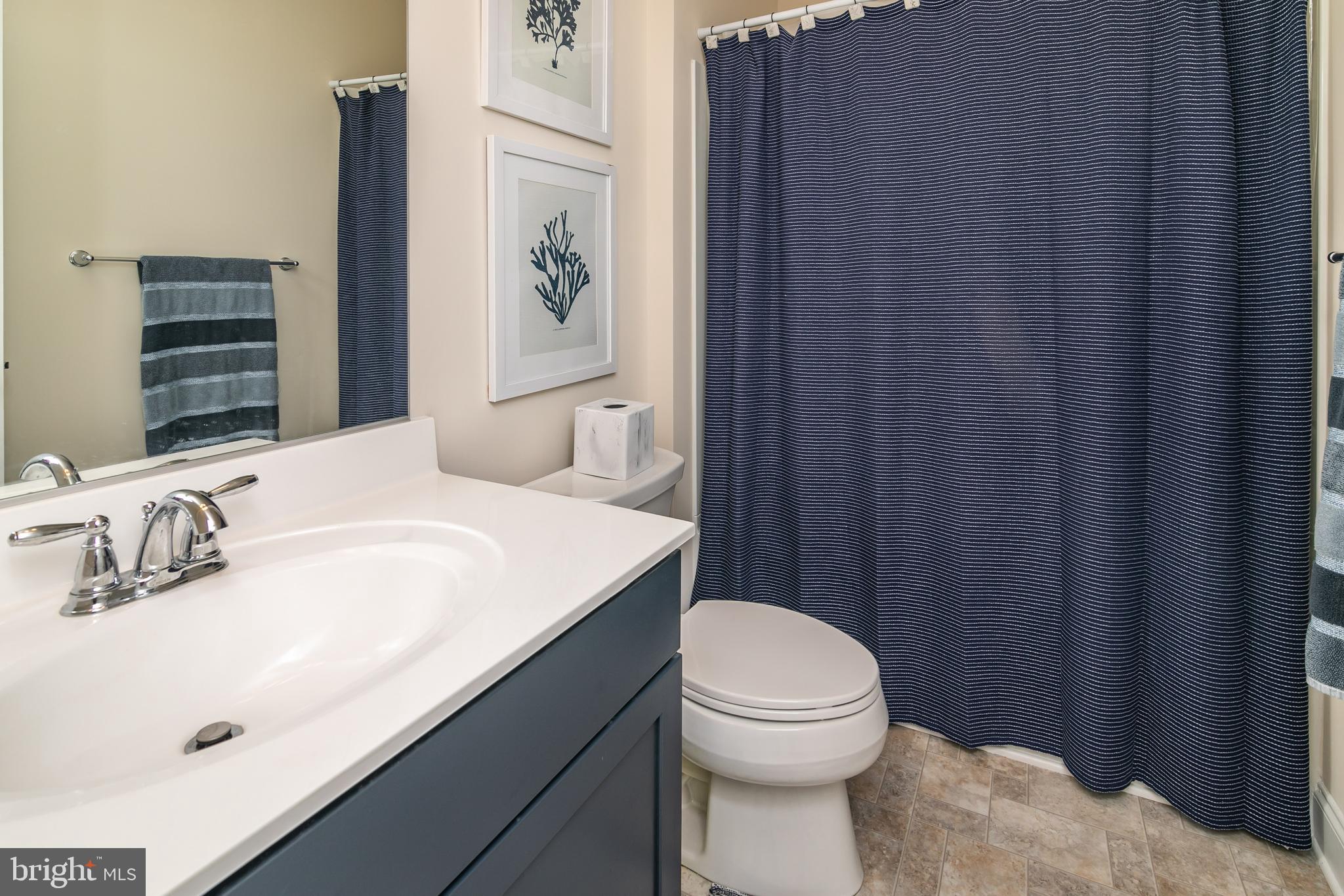 614 Bethany Loop Bethany Beach, DE 19930 - Photo 41 of 92 a bathroom with a sink a toilet and shower