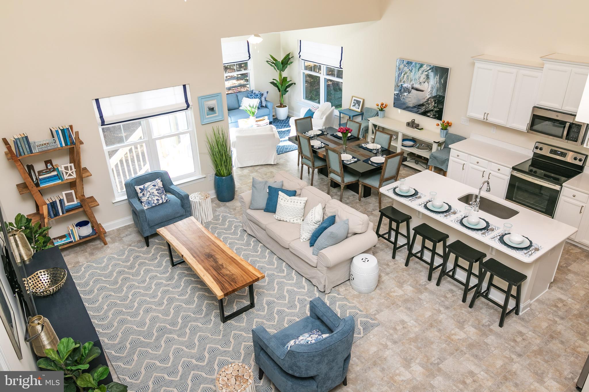 614 Bethany Loop Bethany Beach, DE 19930 - Photo 48 of 92 a living room with furniture and a floor to ceiling window