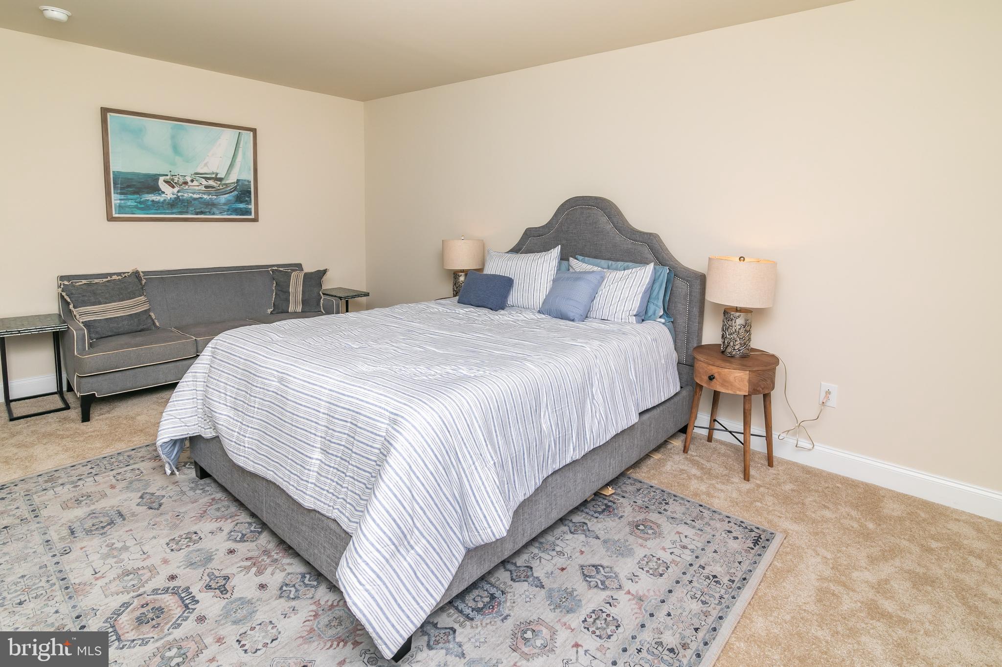 614 Bethany Loop Bethany Beach, DE 19930 - Photo 49 of 92 a bedroom with bed and a painting on the wall