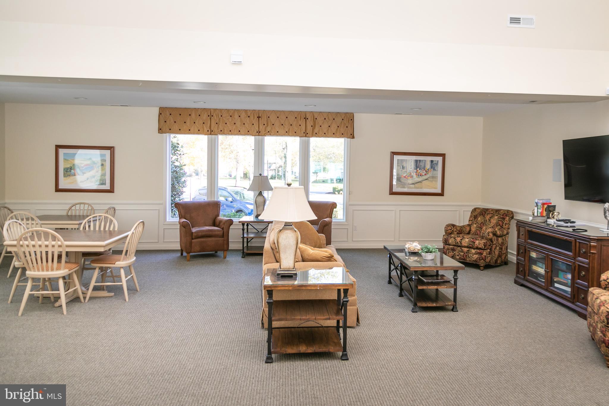614 Bethany Loop Bethany Beach, DE 19930 - Photo 69 of 92 a living room with furniture and a flat screen tv