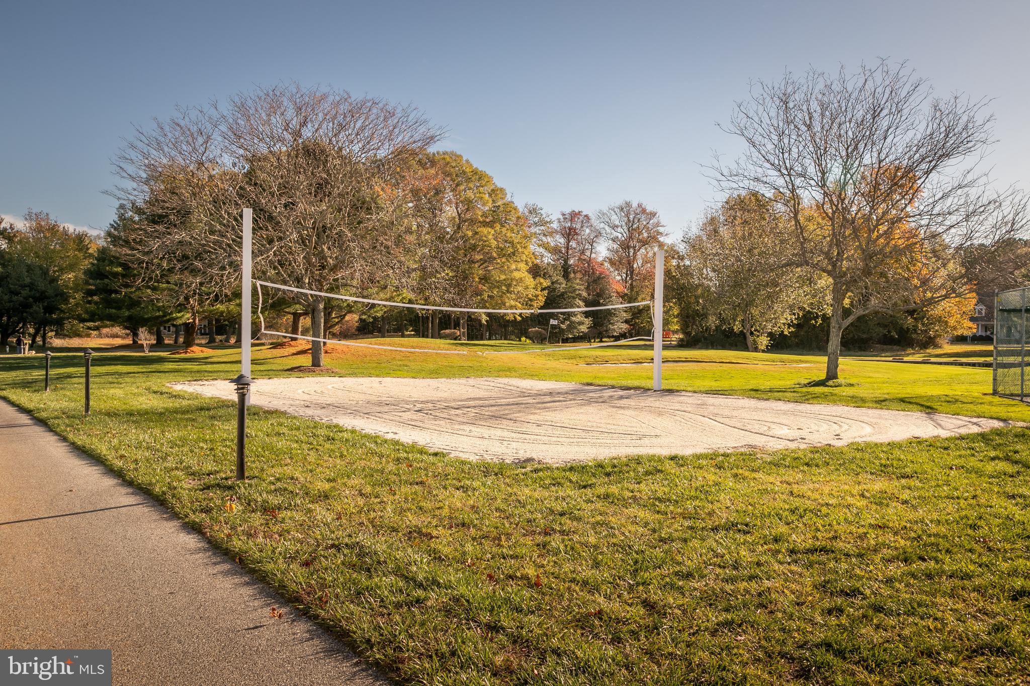 614 Bethany Loop Bethany Beach, DE 19930 - Photo 71 of 92 a view of a swimming pool with an outdoor space and seating area