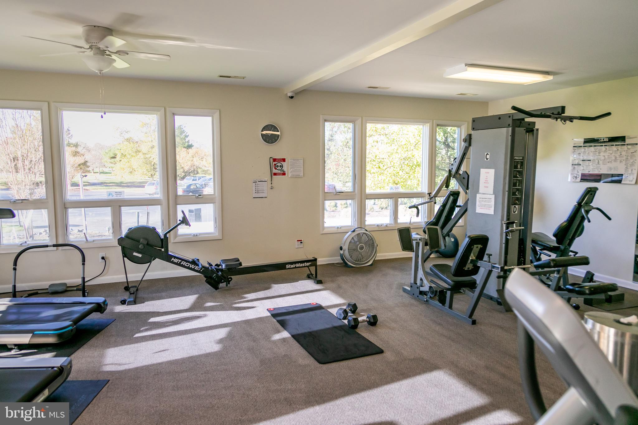 614 Bethany Loop Bethany Beach, DE 19930 - Photo 79 of 92 a living room with furniture a window and gym equipment