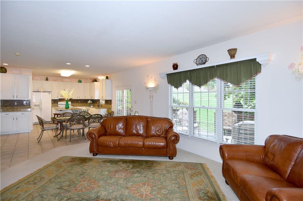 509 Tree Line Drive Gibsonia, PA 15044 - Photo 11 of 25 a living room with furniture kitchen and a large window