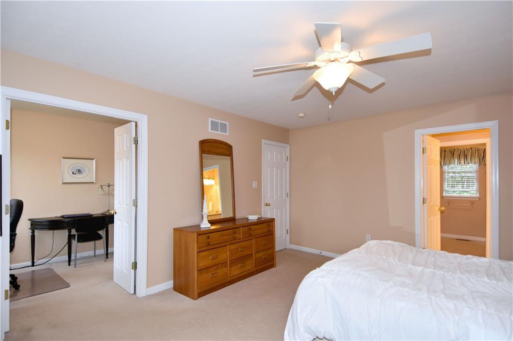 509 Tree Line Drive Gibsonia, PA 15044 - Photo 14 of 25 a bedroom with a bed and a chandelier
