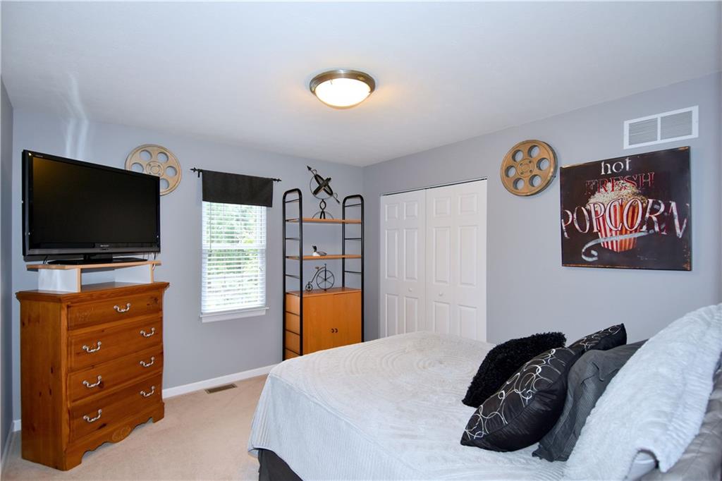 509 Tree Line Drive Gibsonia, PA 15044 - Photo 18 of 25 a bedroom with a bed and a flat screen tv