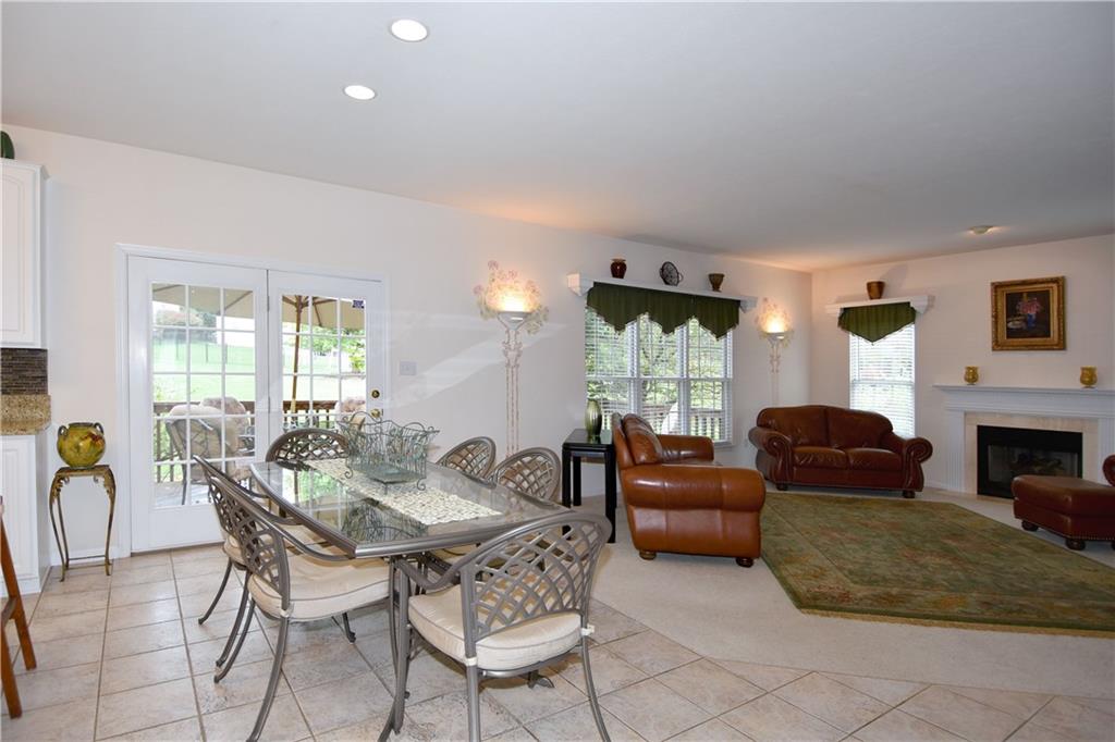 509 Tree Line Drive Gibsonia, PA 15044 - Photo 8 of 25 a living room with furniture a fireplace and a large window