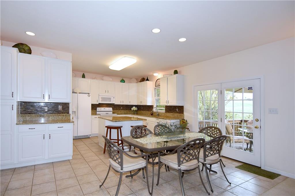 509 Tree Line Drive Gibsonia, PA 15044 - Photo 9 of 25 a view of a dining room with furniture and wooden floor