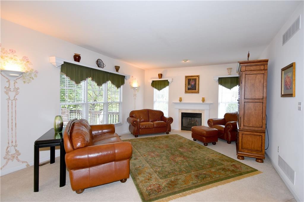 509 Tree Line Drive Gibsonia, PA 15044 - Photo 10 of 25 a living room with furniture fireplace and window