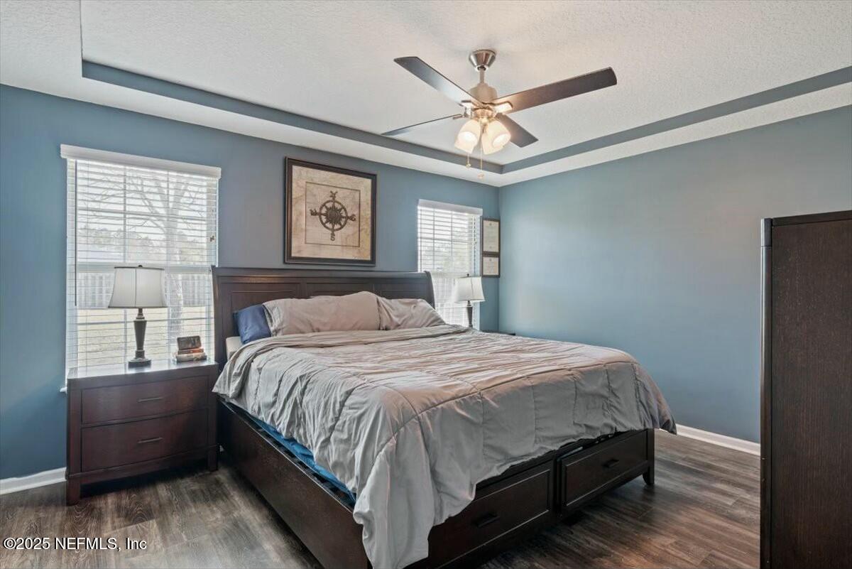 930 Red Fox Way Macclenny, FL 32063 - Photo 16 of 43 a bedroom with a large bed and a window