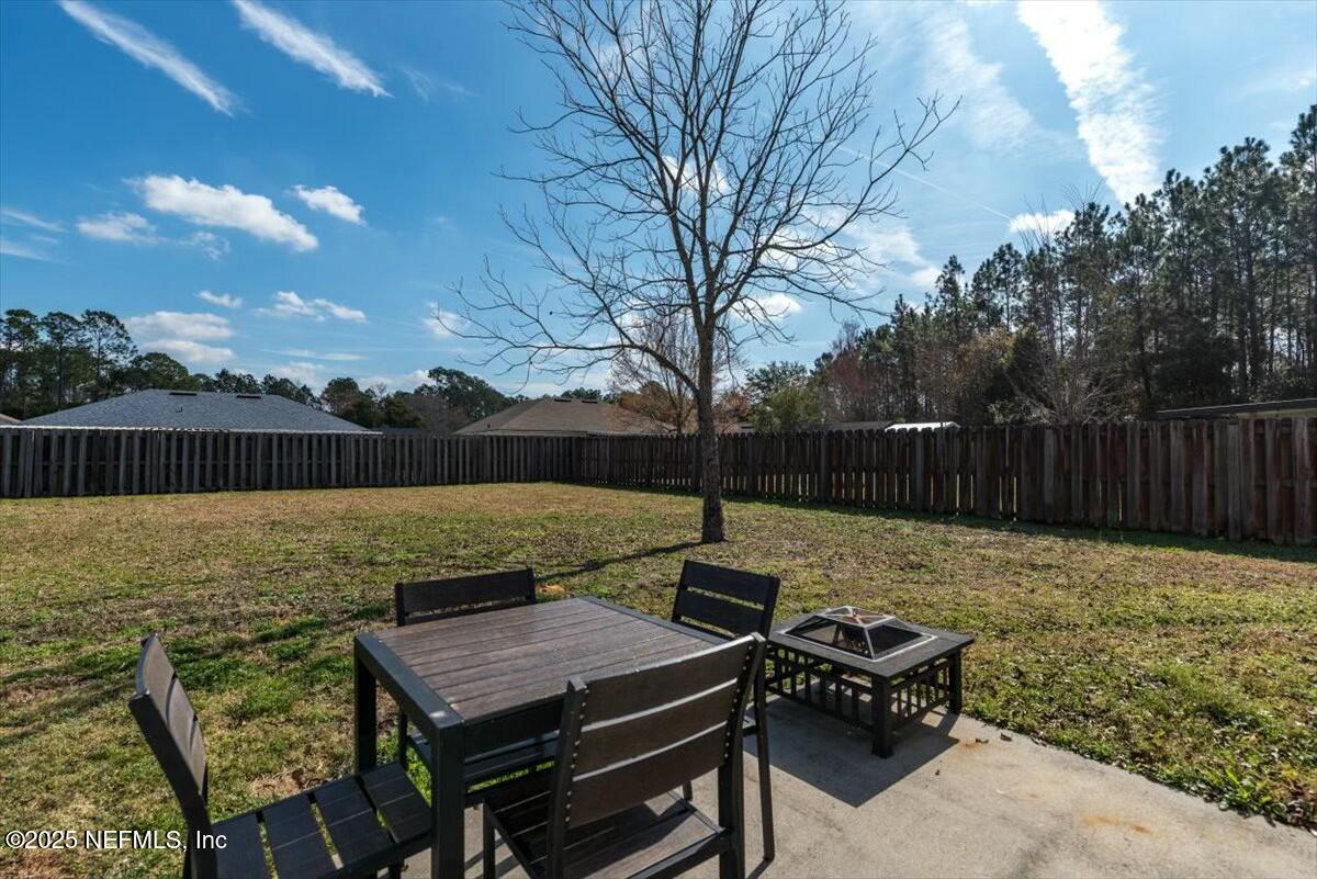 930 Red Fox Way Macclenny, FL 32063 - Photo 28 of 43 a view of a yard with furniture
