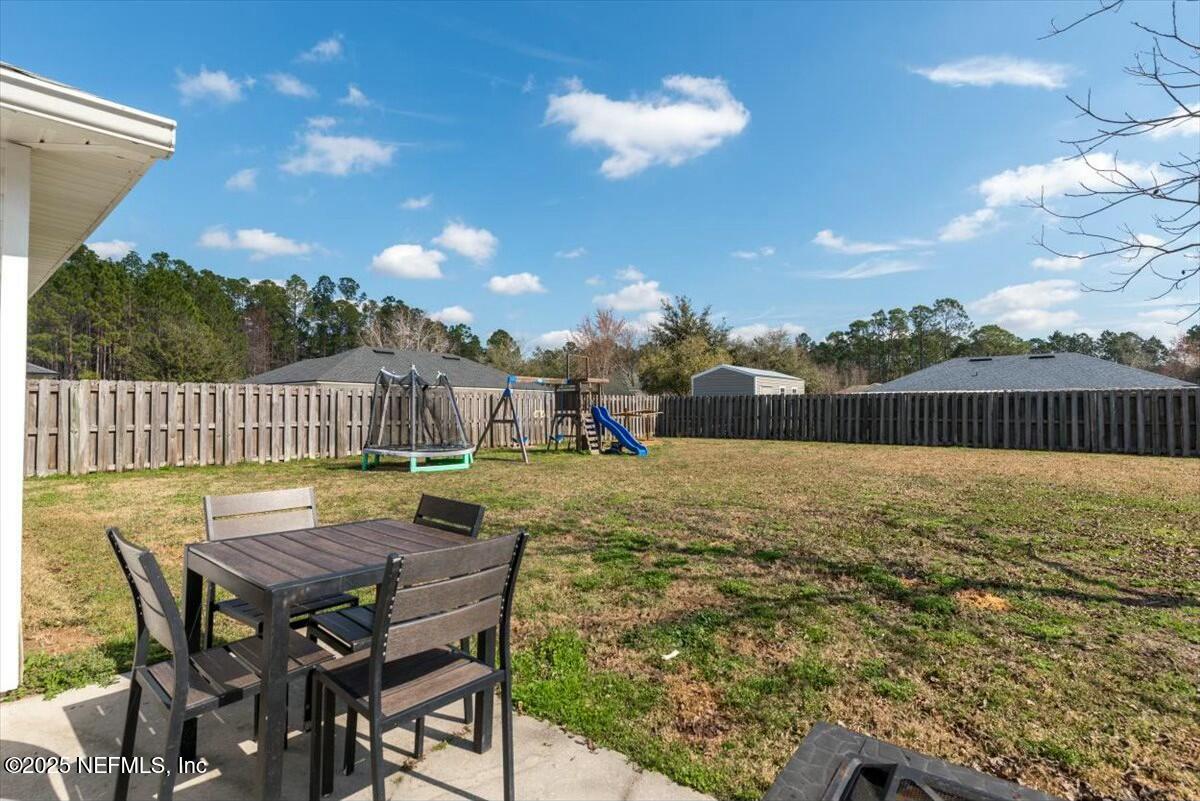 930 Red Fox Way Macclenny, FL 32063 - Photo 29 of 43 a view of an chairs and tables in the patio