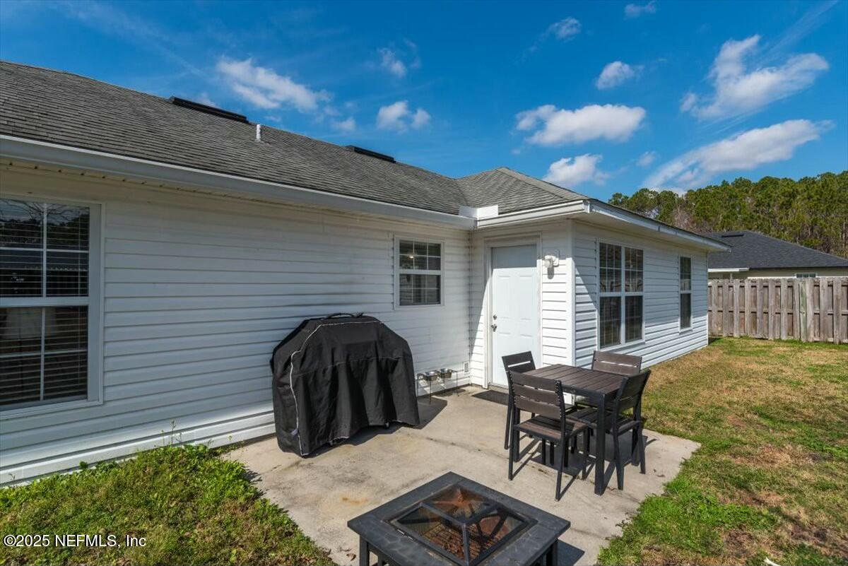 930 Red Fox Way Macclenny, FL 32063 - Photo 30 of 43 a view of backyard with seating space and deck
