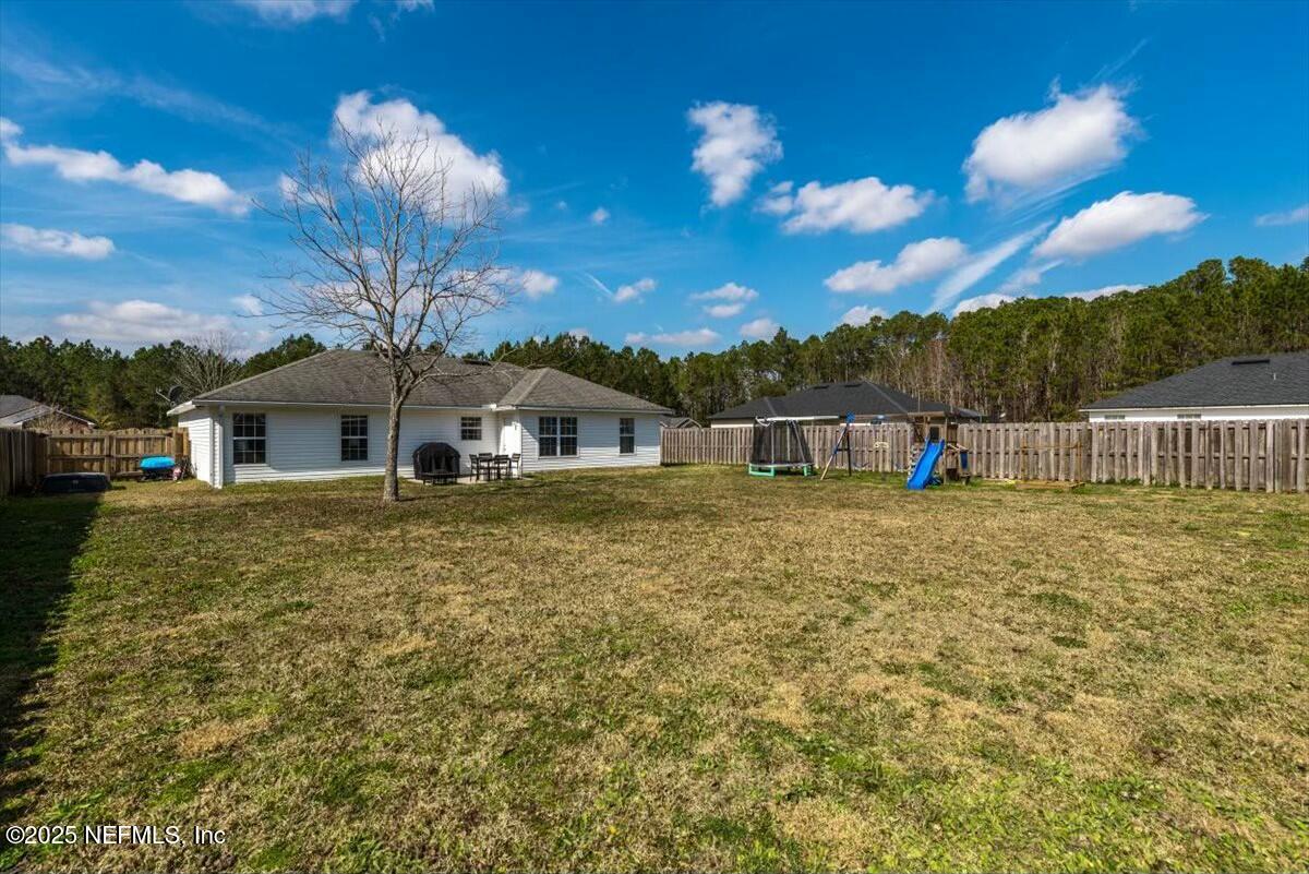 930 Red Fox Way Macclenny, FL 32063 - Photo 32 of 43 a front view of a house with a yard