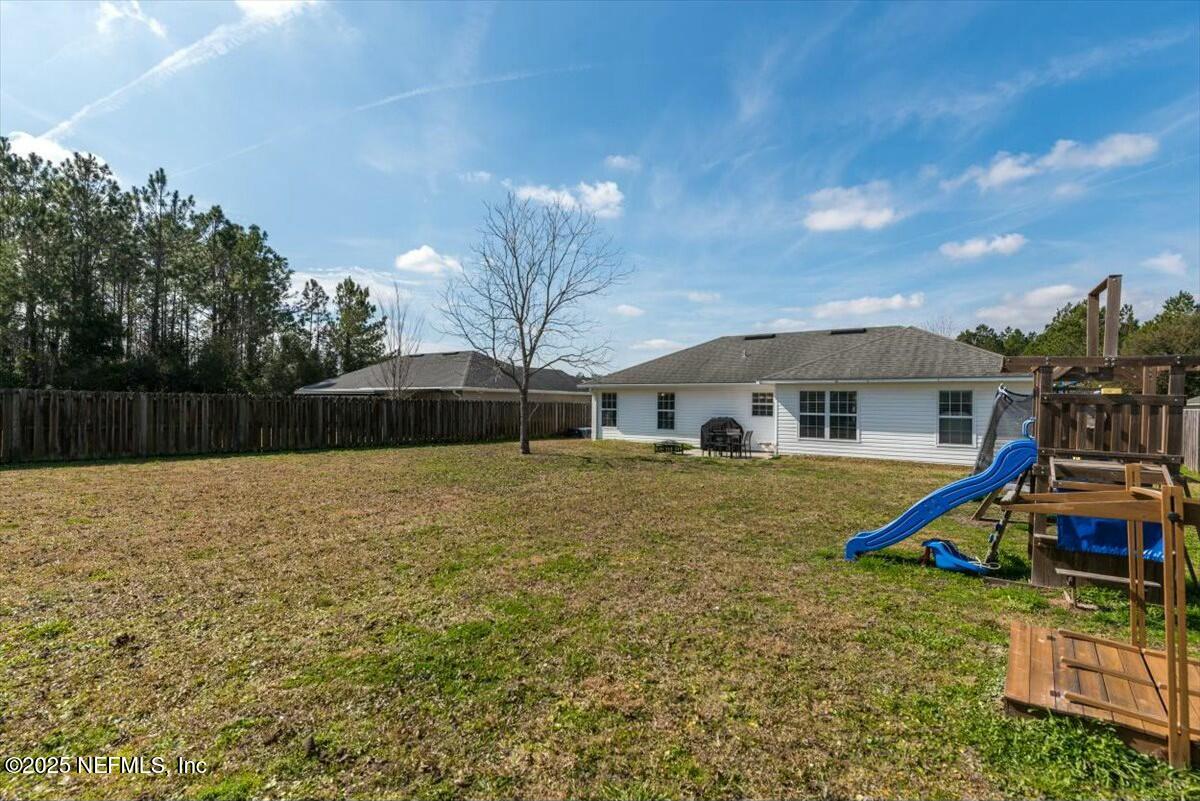 930 Red Fox Way Macclenny, FL 32063 - Photo 33 of 43 a view of a house with backyard and a slide