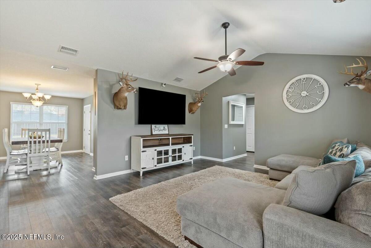 930 Red Fox Way Macclenny, FL 32063 - Photo 5 of 43 a living room with furniture and a flat screen tv