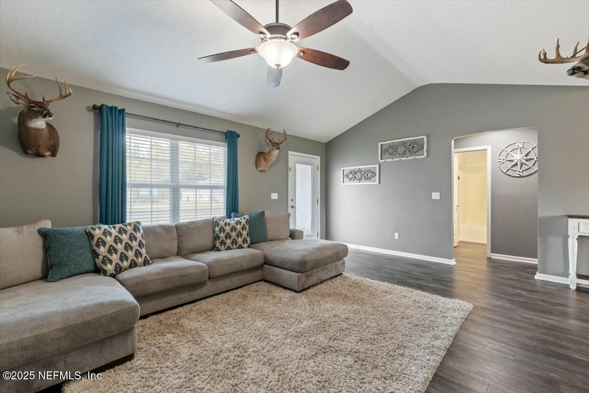 930 Red Fox Way Macclenny, FL 32063 - Photo 7 of 43 a living room with furniture and a window