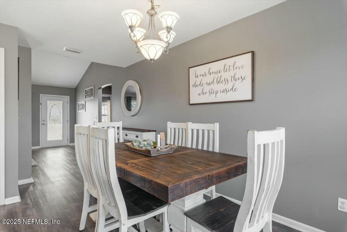 930 Red Fox Way Macclenny, FL 32063 - Photo 10 of 43 a view of a dining room with furniture and chandelier